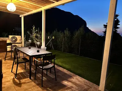 a table and chairs on a patio with a view at Casa Vacanza Villa Corona in San Vito lo Capo