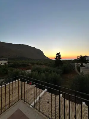 a view of a sunset from a balcony at Casa Vacanza Villa Corona in San Vito lo Capo