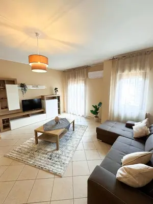 a living room with a couch and a table at Appartamento Trinacria in Castellammare del Golfo
