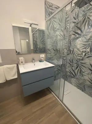 a bathroom with a sink and a shower at Monte Luna - E-bikes incluse per raggiungere il centro e la spiaggia in 3 minuti in San Vito lo Capo