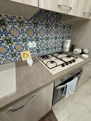 a bathroom with a toilet and a sink and a mirror at Sopra Palermo in Monreale