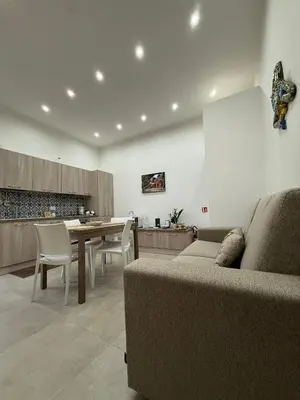 a small bedroom with two beds with blue towels at Sopra Palermo in Monreale