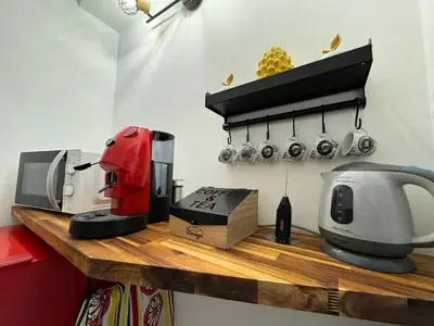 a counter with a coffee maker and a mixer on it at ArcorosaApartment Palermo Centro in Palermo