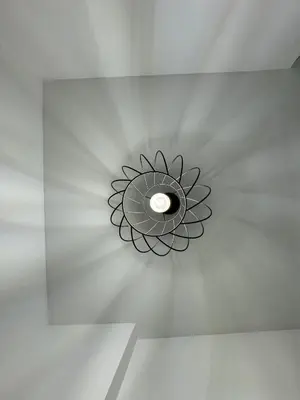a ceiling light with a flower on a ceiling at ArcorosaApartment Palermo Centro in Palermo