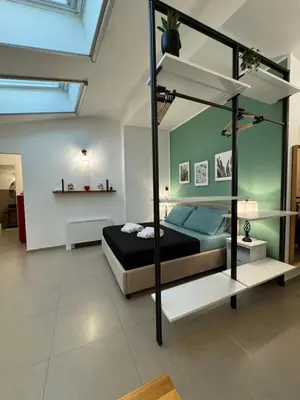 a bedroom with a bunk bed in a room at ArcorosaApartment Palermo Centro in Palermo