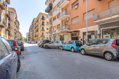 a bunch of cars parked on the side of a street at Appartamento Pacini by Wonderful Italy in Palermo