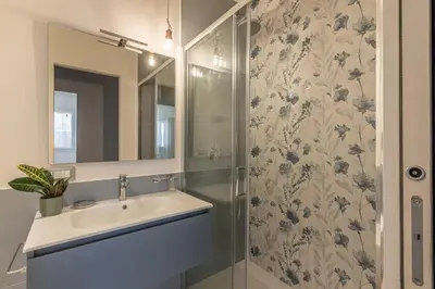 a bathroom with a sink and a shower at Appartamento Pacini by Wonderful Italy in Palermo