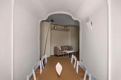 a dining room with a table and chairs at Maruisa suite apartment in Palermo