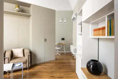 a living room with a couch and a chair at Maruisa suite apartment in Palermo