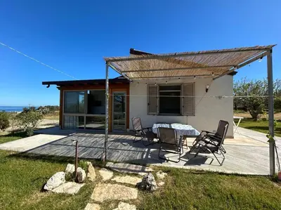 a house on the side of a dirt road at Sunset Holiday House in Cefalù