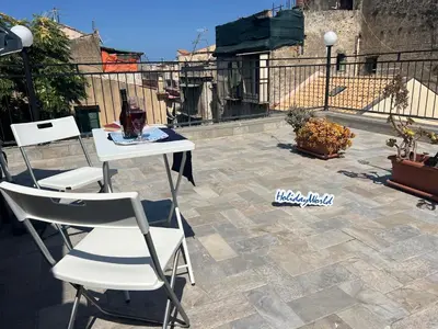 a table and two chairs on a patio at Home al Capo by Holiday World in Palermo