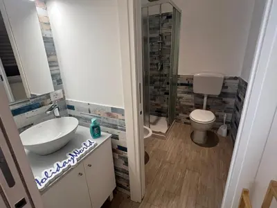a bathroom with a sink and a toilet at Home al Capo by Holiday World in Palermo