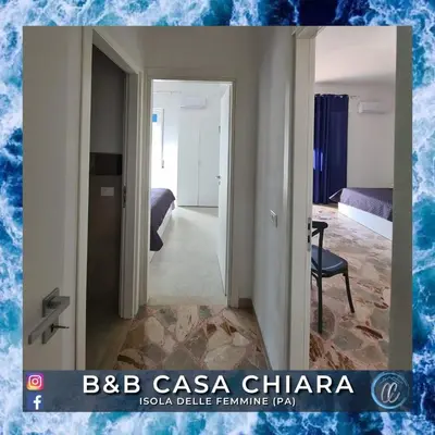 a mirror in a room with a bedroom at Casa Delle Femmine in Isola delle Femmine