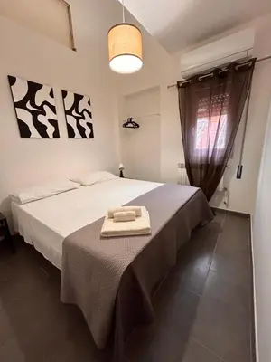 a bedroom with a bed with a towel on it at Finc house in Palermo