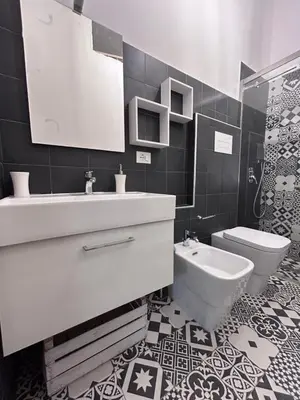 a bathroom with a white sink and a toilet at Finc house in Palermo