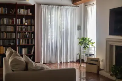 a living room with a couch and a fireplace at iFlat Sicilia Le terrazze blu in Palermo