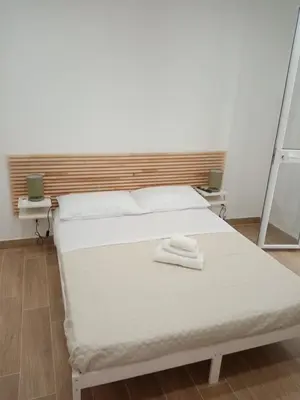 a bedroom with a bed with two towels on it at Mediterranea casa vacanza in Capaci