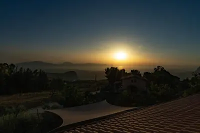 a sunset with a skateboard ramp on a roof at Villa Serena - vasca idromassaggio in Borgetto
