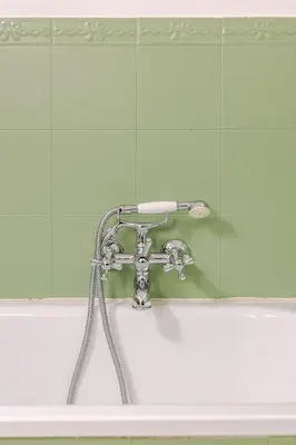 a bath tub with a faucet in a bathroom at Liberty Boutique Apartment in Palermo