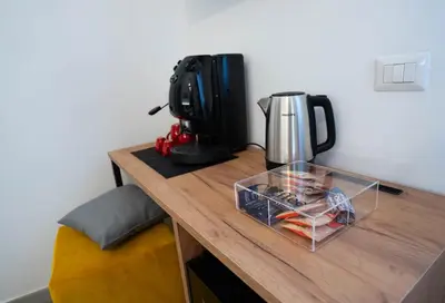 a table with a coffee maker and a coffee pot on it at Le Stanze del Duomo in Partinico