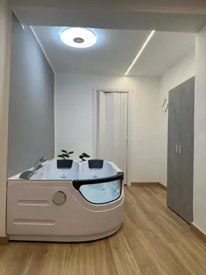 a room with a bath tub with a sink at Lacasadelrelax in Monreale