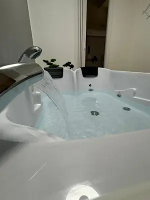 a bath tub with water coming out of it at Lacasadelrelax in Monreale