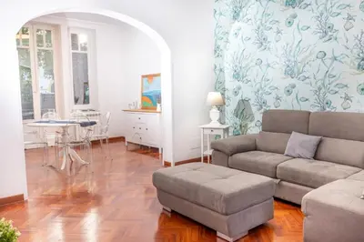 a living room with a couch and a table at Aria di sale in Palermo