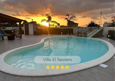 a large swimming pool with a sunset in the background at Villa El Secreto, Luxury con piscina, sauna e idromassaggio, vicina al mare e montagna in Borgetto