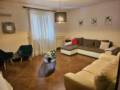 a living room with a couch and a table at Loriano Apartment in Capaci