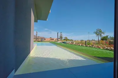 a view of a swimming pool from a building at Dimora Masi di GN Real Escapes in Castellammare del Golfo