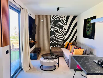 a living room with a couch and a table at Dimora Masi di GN Real Escapes in Castellammare del Golfo