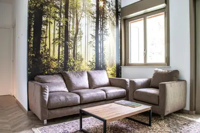 a living room with a couch and a coffee table at Politeama Crystal Rooms in Palermo