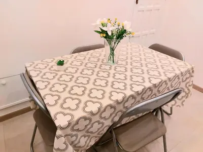 a table with a vase of flowers on it at Murriali Apartment in Monreale
