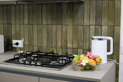 a bowl of fruit on a counter next to a stove at Oasi Porta Felice in Palermo