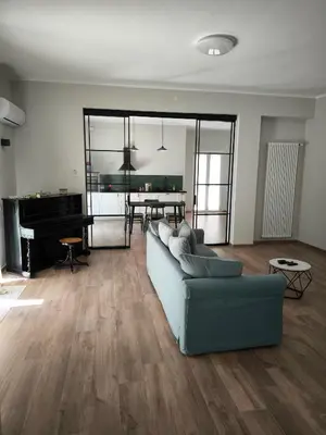 a living room with a couch and a piano at Selenite Home in Palermo