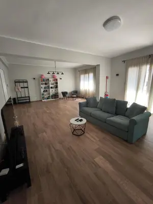 a living room with a couch and a table at Selenite Home in Palermo