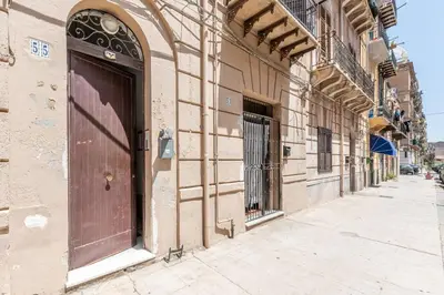 a building with a door on the side of a street at Casa Beatrice con Terrazza by Wonderful Italy in Palermo