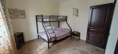 a room with two bunk beds with a ladder at Villa Samay Luxury House in Carini