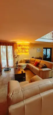 a living room with a couch and a table at Villa Samay Luxury House in Carini