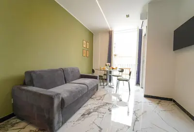 a living room with a couch and a table at Quattro Canti 200 mt- Appartamento Salvia in Palermo