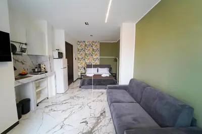a living room with a couch and a bedroom at Quattro Canti 200 mt- Appartamento Salvia in Palermo