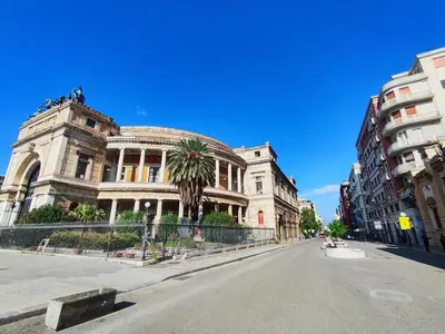 an old building on a street in a city at Politeama guest house Palermo Agave in Palermo