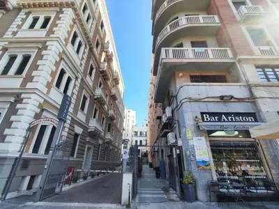 a street in a city with two tall buildings at Politeama guest house Palermo Agave in Palermo