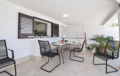 a dining room with a table and chairs at 3 Bedroom Stunning Apartment In Alcamo in Alcamo
