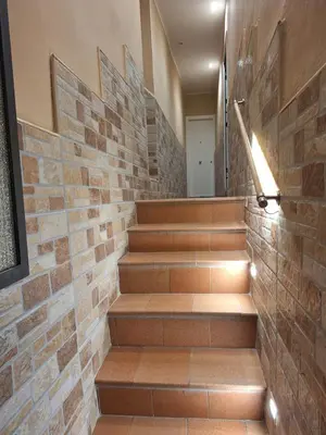 a brick wall with stairs in a hallway at La Casetta di Lussy in Palermo