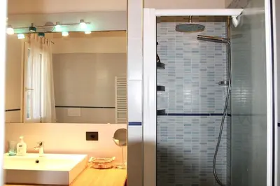 a bathroom with a sink and a shower at Villa Enza Bellissima villa con piscina in Terrasini