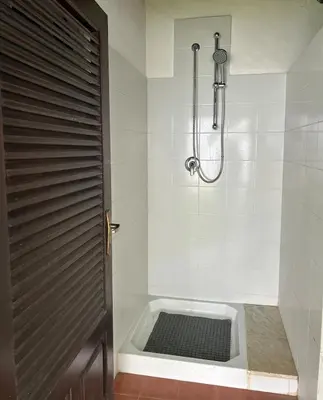 a bathroom with a shower and a bath tub at Villa Marea Mondello in Palermo