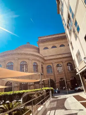 a large building with a staircase in front of it at casadeb orleans in Palermo