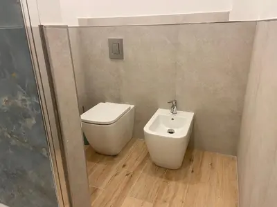 a bathroom with a toilet and a bidet at La Zisa Luxury Apartment in Palermo
