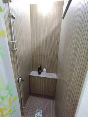 a bathroom with a shower with a counter in it at House of Lady in Carini